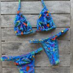 Tropical floral bikini set with blue base and vibrant island colors by Pear