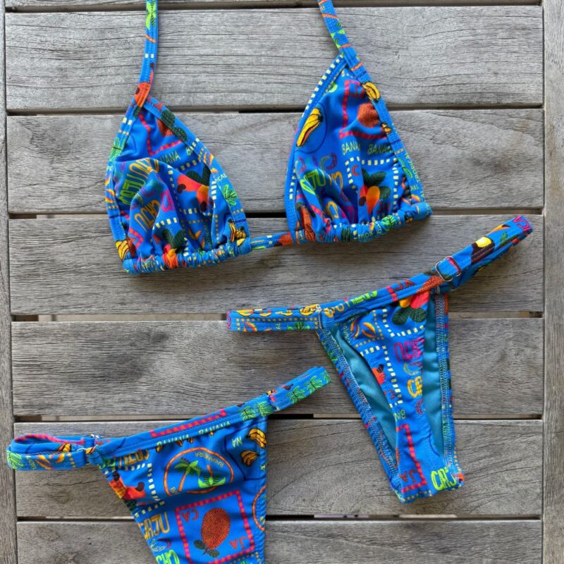 Tropical floral bikini set with blue base and vibrant island colors by Pear